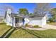 Cozy front porch welcomes you to this painted brick home with blue front door at 9861 Levenshall Dr, Ladson, SC 29456