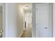 Bright hallway featuring wood floors and leading to various rooms in the home at 9861 Levenshall Dr, Ladson, SC 29456