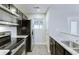 Modern kitchen with granite countertops and stainless steel appliances at 9861 Levenshall Dr, Ladson, SC 29456
