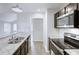 Modern kitchen with stainless steel appliances, granite countertops, and white tile backsplash at 9861 Levenshall Dr, Ladson, SC 29456