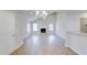 Spacious living room with hardwood floors, a fireplace, and an adjacent breakfast bar at 9861 Levenshall Dr, Ladson, SC 29456