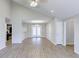 Open-concept living room with vaulted ceilings, hardwood floors, recessed lighting, and access to kitchen at 9861 Levenshall Dr, Ladson, SC 29456