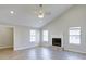 Spacious living room features a vaulted ceiling, recessed lighting, a fireplace and large windows at 9861 Levenshall Dr, Ladson, SC 29456