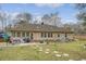 Wide backyard view with stone pathway, patio area, and grassy lawn, ideal for outdoor enjoyment at 101 Plantation Dr, Summerville, SC 29485