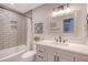 Stylish bathroom boasts a tiled shower, modern vanity, and attractive lighting fixtures at 101 Plantation Dr, Summerville, SC 29485