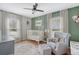 Cozy Bedroom with a white crib, stylish decor, and a comfortable chair, creating a nurturing environment at 101 Plantation Dr, Summerville, SC 29485