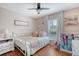 Cozy bedroom features wood floors, decorative walls, and a ceiling fan at 101 Plantation Dr, Summerville, SC 29485