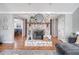 Cozy fireplace with decorative brick surround, wooden mantle, and stylish accents in the living area at 101 Plantation Dr, Summerville, SC 29485