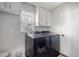 Functional laundry room with modern appliances, storage cabinets, and natural light at 101 Plantation Dr, Summerville, SC 29485