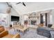Spacious living room with vaulted ceilings, brick fireplace, hardwood floors, and modern furnishings at 101 Plantation Dr, Summerville, SC 29485