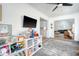 Bright and airy living room with modern furnishings, play area, and seamless flow into the kitchen and common area at 101 Plantation Dr, Summerville, SC 29485