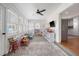 Bright sunroom filled with natural light, showcasing a ceiling fan and ample space for play and relaxation at 101 Plantation Dr, Summerville, SC 29485