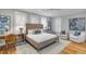 Serene bedroom with a stylish bed, ample natural light, and a comfortable sitting area at 108 Carolina Blvd, Isle of Palms, SC 29451