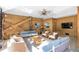 Covered patio with comfortable seating, ceiling fan, and wood paneling accents at 108 Carolina Blvd, Isle of Palms, SC 29451