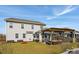 Large backyard with a covered patio, lush green grass, and a two-story home at 109 Airy Dr, Summerville, SC 29486