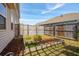 Backyard with a small garden, wooden fence, and lush green grass at 109 Airy Dr, Summerville, SC 29486
