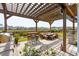 Backyard patio with outdoor kitchen, table with stools, dining, and comfortable seating at 109 Airy Dr, Summerville, SC 29486