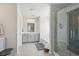 Modern bathroom features a glass-enclosed shower, a soaking tub, and double vanity sinks at 109 Airy Dr, Summerville, SC 29486