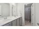 Bright bathroom with double vanity, modern fixtures, and access to a separate shower/tub area at 109 Airy Dr, Summerville, SC 29486