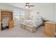 Well-lit bedroom features a ceiling fan, a window, and a built-in bookcase for a cozy, inviting space at 109 Airy Dr, Summerville, SC 29486