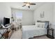 Inviting bedroom with modern furnishings, including a ceiling fan, a desk, and large window at 109 Airy Dr, Summerville, SC 29486