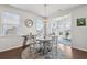 Sun-drenched breakfast nook with a round table, four chairs, and bright windows at 109 Airy Dr, Summerville, SC 29486