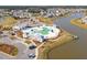 Aerial shot showcasing a large community pool area with ample seating, cabanas, and convenient parking at 109 Airy Dr, Summerville, SC 29486