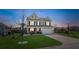 Inviting two-story home with lush lawn and landscaping at dusk at 109 Airy Dr, Summerville, SC 29486
