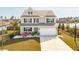 Charming two-story home boasts manicured landscaping, two-car garage, and inviting curb appeal at 109 Airy Dr, Summerville, SC 29486