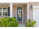 Inviting front door with glass panes, sidelight, and a hello doormat at 109 Airy Dr, Summerville, SC 29486