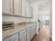 Bright kitchen boasts granite countertops, stainless steel toaster oven, and ample cabinet space for storage at 109 Airy Dr, Summerville, SC 29486