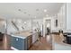 Modern kitchen features an island with granite countertops, stainless steel appliances, and hardwood flooring at 109 Airy Dr, Summerville, SC 29486