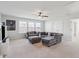 Spacious living room with plush gray seating, a ceiling fan, and plenty of natural light at 109 Airy Dr, Summerville, SC 29486
