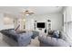 Comfortable upstairs living room with gray sofas, a TV, and bright natural light at 109 Airy Dr, Summerville, SC 29486