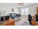Cozy office features a ceiling fan, large window, and comfortable seating for a productive workspace at 109 Airy Dr, Summerville, SC 29486