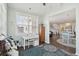 Bright office area features a large window, hardwood floors, and a stylish blue rug at 109 Airy Dr, Summerville, SC 29486