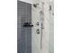 Sleek shower with gray and white marble tile, a rain shower head, and modern fixtures at 109 Airy Dr, Summerville, SC 29486