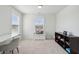 Bright sitting area with comfortable furniture and plenty of natural light from two large windows at 109 Airy Dr, Summerville, SC 29486