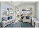 Bright sunroom with bench seating, storage baskets, and natural light at 109 Airy Dr, Summerville, SC 29486