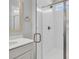 Close-up of a bathroom shower featuring white subway tiles, glass door, and modern fixtures at 110 Brown Swiss Cir, Summerville, SC 29483