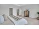 Comfortable bedroom featuring a soft bed, minimalist decor, and easy access to the closet and bathroom at 110 Brown Swiss Cir, Summerville, SC 29483