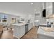 Open-concept kitchen with a large island, sleek appliances, and an adjacent dining area at 110 Brown Swiss Cir, Summerville, SC 29483