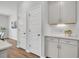 Galley kitchen with a beverage station, sleek hardware, and stainless appliances at 110 Brown Swiss Cir, Summerville, SC 29483