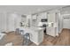 Well-lit kitchen featuring stainless steel appliances, quartz countertops, and stylish bar stool seating at 110 Brown Swiss Cir, Summerville, SC 29483