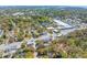 Expansive aerial view of a neighborhood featuring streets, trees, and buildings at 1100 Sea Island Crossing Ln, Mount Pleasant, SC 29464