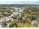 High aerial view showcasing roads, foliage, and mixed buildings at 1100 Sea Island Crossing Ln, Mount Pleasant, SC 29464