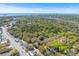 Aerial view of a residential area with mature trees, streets, and homes at 1100 Sea Island Crossing Ln, Mount Pleasant, SC 29464