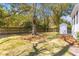 Expansive backyard featuring mature trees, a fenced perimeter, and a storage shed at 1100 Sea Island Crossing Ln, Mount Pleasant, SC 29464