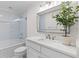 Bright bathroom features a glass-enclosed tub/shower and modern vanity at 1100 Sea Island Crossing Ln, Mount Pleasant, SC 29464