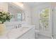 Stylish bathroom with white marble countertops, patterned tile floor, and decorative mirror at 1100 Sea Island Crossing Ln, Mount Pleasant, SC 29464